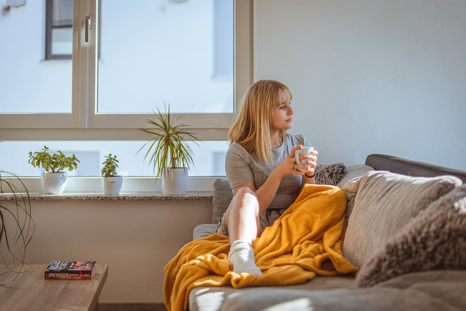 A woman at home, living well between tests